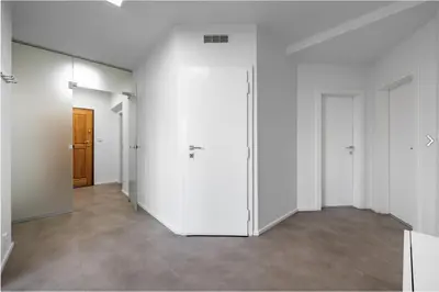 an empty room with white walls and white doors at Stylish 3-Room Flat City Views in Prague