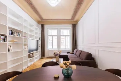 a living room with a table and a couch at Apartment Manes in Prague