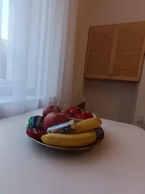 a bowl of fruit sitting on a table at Apartmány Podol in Prague