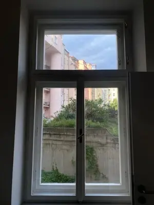 a window with a view of a city at Cozy studio in Prague favorite neighborhood in Prague