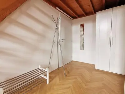 a room with a sculpture in the corner of a wall at Cosy and simple well located studio in Prague