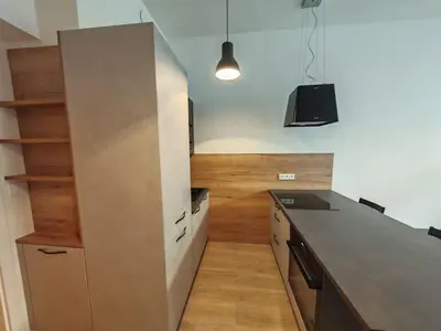 a kitchen with a counter top and a refrigerator at Quiet Studio in Hip Zizkov in Prague