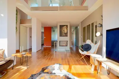 a living room filled with furniture and a flat screen tv at Luxury Prague Penthouse with Heated Floors, Castle Views & Rooftop Terrace in Prague