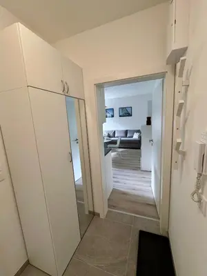 a hallway with a door leading to a living room at Byt u letiště v Praze in Tuchoměřice