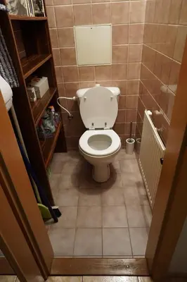a bathroom with a toilet in a small room at Central two floor flat by Charles Bridge in Prague