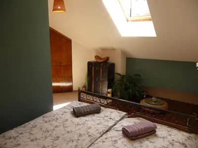 a bedroom with a bed with two pillows on it at Central two floor flat by Charles Bridge in Prague