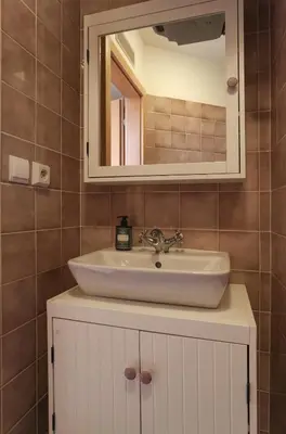 a bathroom with a sink and a mirror at Central two floor flat by Charles Bridge in Prague