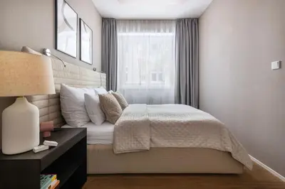 a bedroom with a bed and a window at Modern apartment near Old Town in Prague