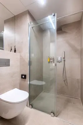 a shower stall in a bathroom with a toilet at Modern apartment near Old Town in Prague