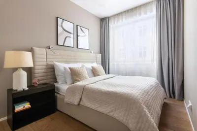 a bedroom with a large bed and a window at Modern apartment near Old Town in Prague