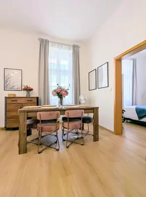 a dining room with a table and two chairs at New Town 2 BDR, free coffee in Prague