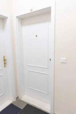 a white closet with white doors in a room at Central Studio by Museum and Old Town in Prague