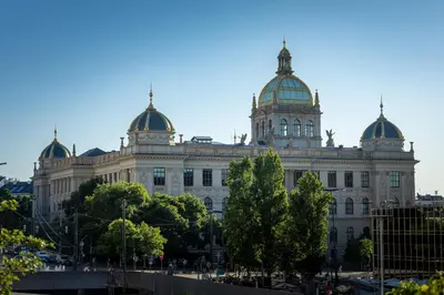 a large building with domes on top of it at Central Studio by Museum and Old Town in Prague