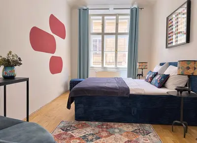 a bedroom with a bed and a window at No2 Style & Design XXL City Centre Apartment in Prague