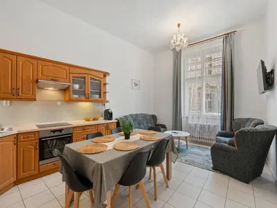a kitchen and dining room with a table and chairs at Apartment Old Town home-7 by Interhome in Prague