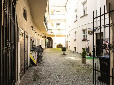 an alley in a building with a gate and bikes at Apartment Old Town home-7 by Interhome in Prague