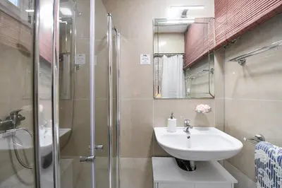 a bathroom with a sink and a shower at Old Town apt, Charles Bridge 3 min, Private garden, Breakfast in Knight hall in Prague