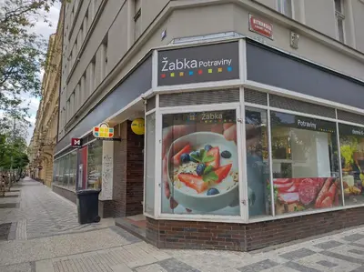 a store front with a display window on a street at Комфортная, уютная,романтичная in Prague