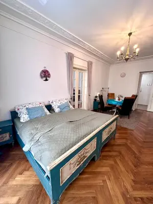 a bedroom with a large bed in a room at Štepánská 3 in Prague
