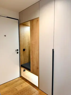 a room with a sliding glass door and a bench at Lengo Apartment Smichov in Prague