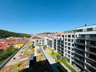 an aerial view of a city with buildings at Lengo Apartment Smichov in Prague