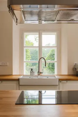 a kitchen with a sink and a window at Zámecká Stodola - Červený Hrádek u Sedlčan in Sedlčany