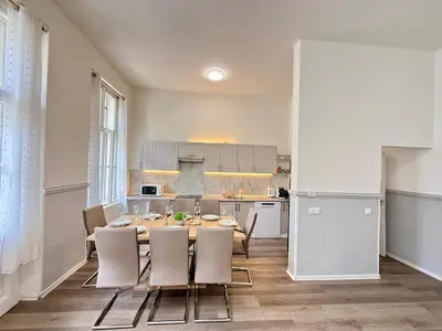 a kitchen and dining room with a table and chairs at FREE PARKING- 2BDR Apartment in Wenceslas Square in Prague