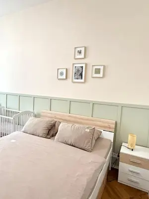 a bedroom with a bed and three pictures on the wall at FREE PARKING- 2BDR Apartment in Wenceslas Square in Prague