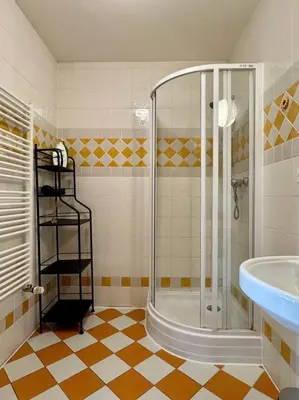 a bathroom with a shower and a sink at Lumi Retreat Prague in Prague