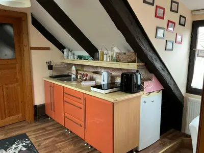 a kitchen with a sink and a counter top at Apartmány na náměstí - Kounice in Kounice