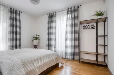 a bedroom with a bed and a window at Apartment with garden in Prague 6 in Prague