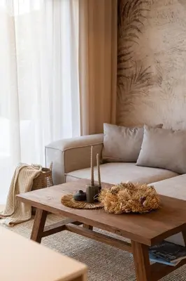a living room with a couch and a coffee table at Dock by STING Hotels in Prague