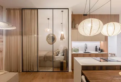 a kitchen with a glass door leading to a bedroom at Dock by STING Hotels in Prague