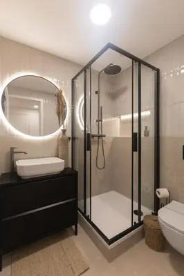 a bathroom with a shower and a sink and a mirror at Dock by STING Hotels in Prague