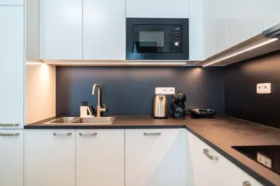 a kitchen with a sink and a microwave at Crystal Apartment in Center of Prague in Prague