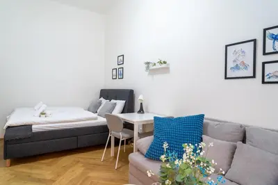a living room with a couch and a table at Crystal Apartment in Center of Prague in Prague
