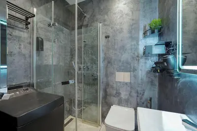 a bathroom with a shower and a toilet and a sink at Modern Industry Studio in Prague