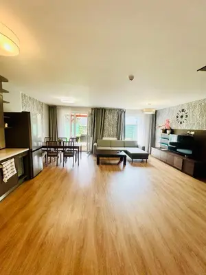 a living room with a couch and a table at Villa many separate rooms with Free Parking Praha 4 libuš in Prague