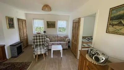 a living room with a couch and a table at Chata Družec in Družec