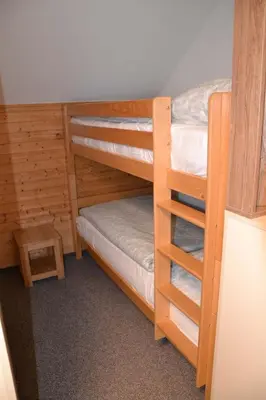 a bedroom with two bunk beds with a ladder at Župky in Županovice