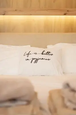 a sign on a pillow on a bed at The Urban Nest Metro Line in Prague