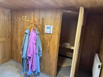 a robe hanging on a wall in a room at Luxusní chalupa Kokořínsko