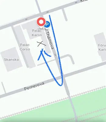 a map with a blue arrow pointing to a parking lot at Bijou house in a private garden! in Prague