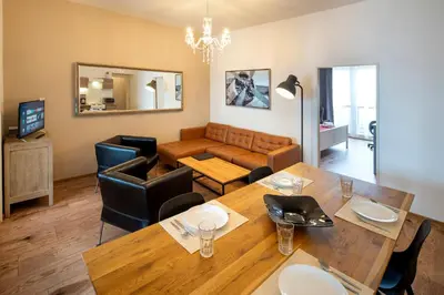 a balcony with a table and chairs on a balcony at New Town - Apple Apartments in Prague