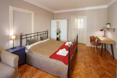 a bathroom with a shower and a toilet and a door at Old Town - Templova Apartments in Prague