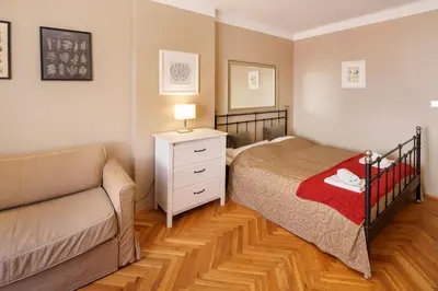 a bedroom with a desk and a tv in a room at Old Town - Templova Apartments in Prague