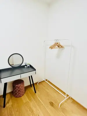 a mirror and a table in a room with a wall at Luxury apartments with beautiful views in Prague