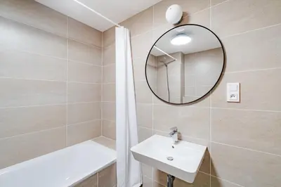 a bathroom with a sink and a mirror at Blueground Prague 9 balcony free parking PRG-46 in Prague