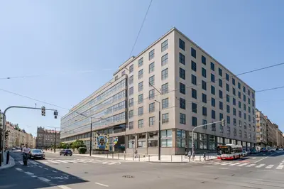 a large building on the corner of a street at Blueground Letná furnished studio foodie area PRG-49 in Prague