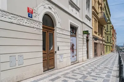 an empty street in a city with buildings at Blueground Letná furnished studio foodie area PRG-54 in Prague